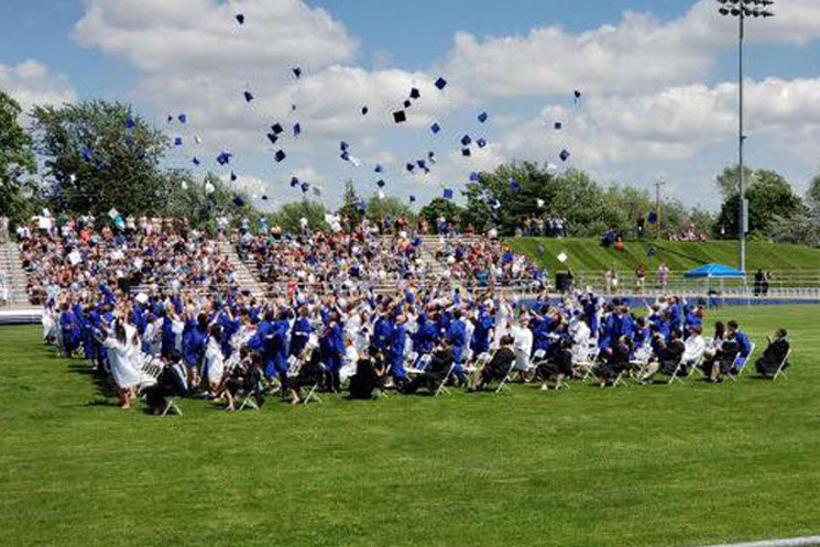 Students graduate from Adrian High School in Adrian, Michigan.