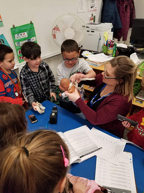 Teacher giving student a high five.